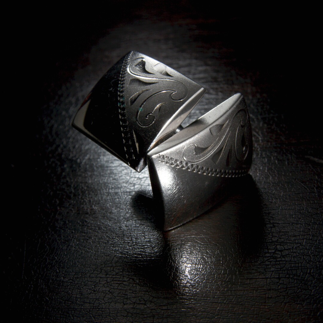 A pair of silver cuff links