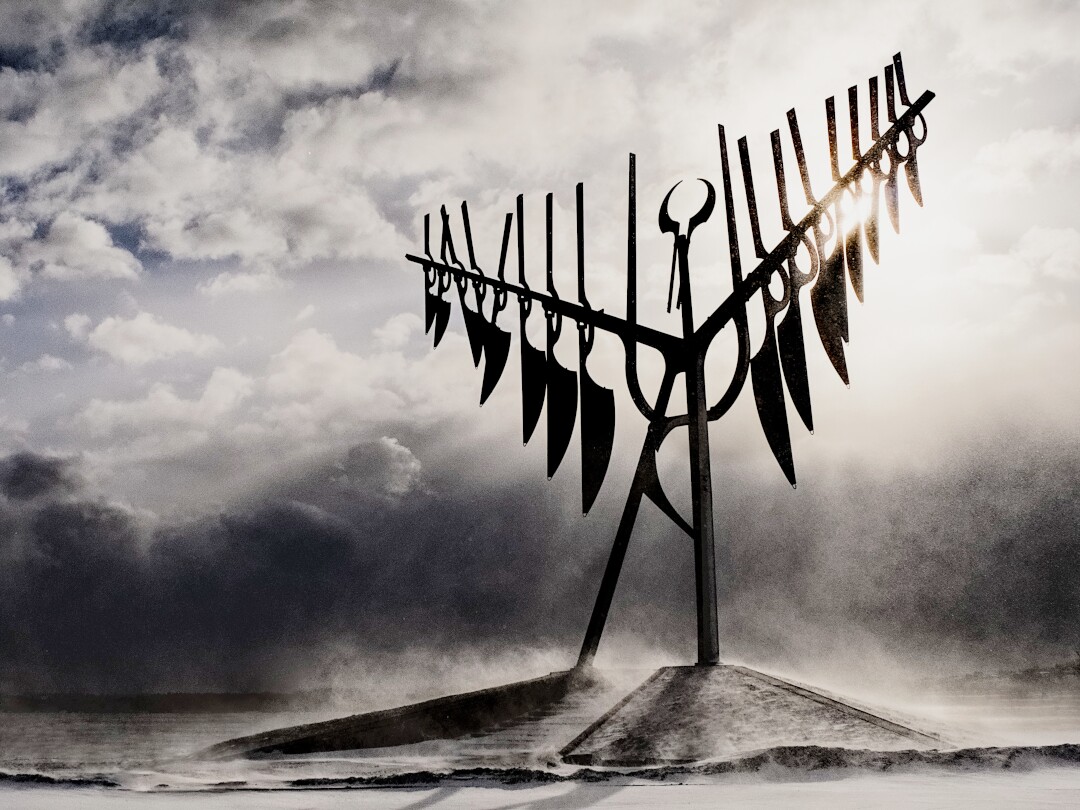 The spirit catcher sculpture in Barrie Ontario against a wind- and snow-swept sky